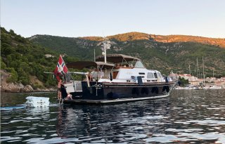 Children playing onboard a boat in Norway in the sunset