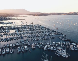 Crowded marina with yachts, vessels and sailboats